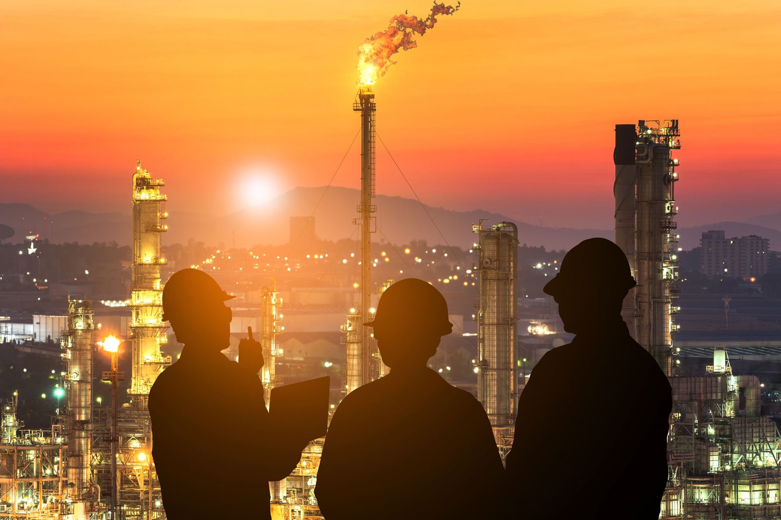 rear-view-silhouette-man-buildings-against-sky-sunset